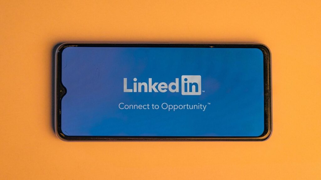 A cell phone with LinkedIn on Screen
