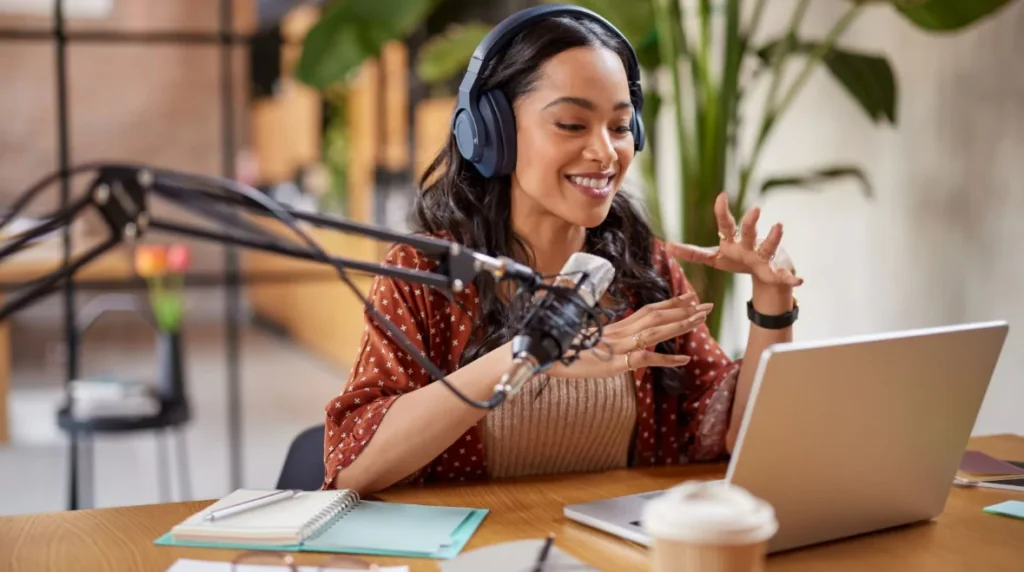 A person wearing headphones and talking into a microphone